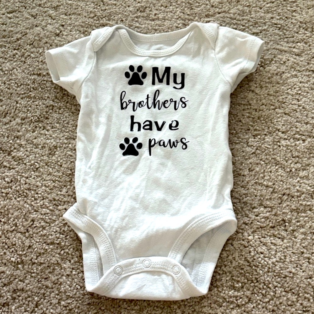 White Baby Onesie with Paw Print Design